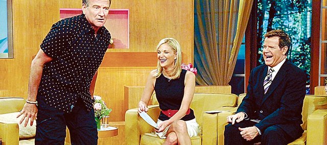 Mike Jerrick, right, and cohost Juliet Huddy enjoy a guest appearance by Robin Williams on the set of "The Morning Show with Mike and Juliet."