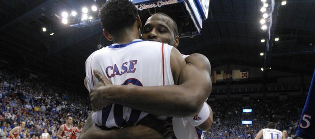 Kansas' Darnell Jackson gives his fellow senior teammate Jeremy Case a bear hug on the sidelines during the Texas Tech blowout on Monday at Allen Fieldhouse. The Jayhawks shredded the Red Raiders, 109-51.