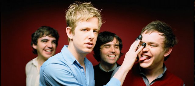 Rob Pope, right, is a longtime Lawrence musician who recently was recruited to join the acclaimed band Spoon. Other members of the Austin, Texas, act include Jim Eno, left, Britt Daniel and Eric Harvey.