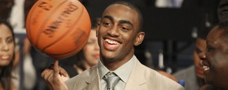 Kansas' Darrell Arthur plays with a basketball at his table in the green room before the start of the first round of the NBA Draft. Arthur fell to the 27th pick of the first round and was traded three times before the night ended but said he was happy he landed in Memphis.