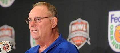 Kansas defensive coordinator Bill Young speaks with media members during a press conference in this Dec. 30, 2007, file photo. Young was hired as the Oklahoma State Cowboys' defensive coordinator on Tuesday.