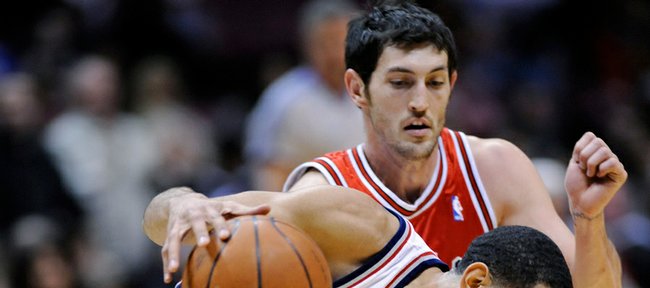 Chicago Bulls' Kirk Hinrich defends against New Jersey Nets' Devin Harris during the fourth quarter of an NBA basketball game Wednesday, Feb. 25, 2009 in East Rutherford, N.J. The Nets beat the Bulls 111-99.