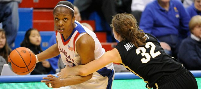 KU's Danielle McCray tries to make a move on Colorado's Kelly Jo Mullaney during the Jayhawks' matchup with CU on Feb. 4, 2009.
