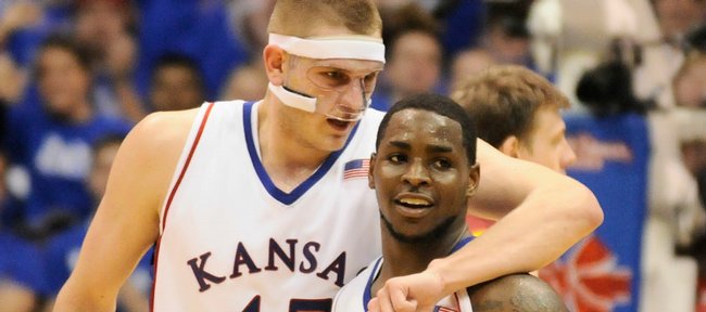 Kansas center Cole Aldrich puts his arm around guard Sherron Collins as the two make their way from the floor late in the second half against  Iowa State Wednesday, Feb. 18, 2009 at Allen Fieldhouse.