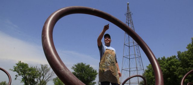 Stephen Johnson looks over his latest project called “Freedom Rings,” at the Wakarusa River Valley Heritage Museum. The sculpture, which was still yet to be painted, will serve as a beacon of light and symbol of freedom to represent the history of the region and the Underground Railroad.