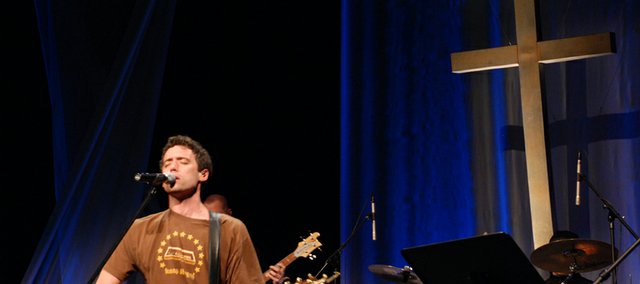 Matt Cox, foreground, a former Lawrence resident, performs at EastLake Community Church in Seattle. He and wife Emily, along with an eight-person team from Seattle, will begin a new EastLake church in Lawrence this fall.