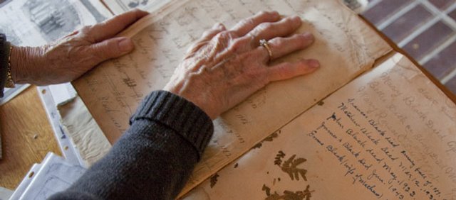 Frieda Culbertson's family Bible is from her mother's side of the family and originated in Scotland in the 1840s. It was brought from Scotland to the United States and eventually made the trip across the pond three times with the family patriarch James Black. The Bible's journey is evident with a water mark and dried pressed flowers from long ago.