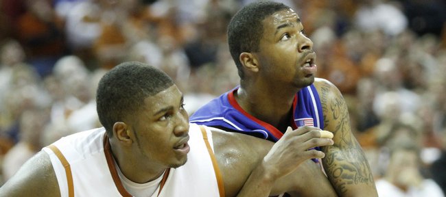 Kansas forward Marcus Morris tangles with Texas center Dexter Pittman during the second half, Monday, Feb. 8, 2010 at the Frank Erwin Center in Austin.