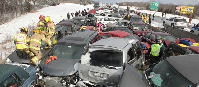 Journal-World photographer Richard Gwin photographed the scene of a pileup on Interstate 70 after a sudden snowstorm Feb. 14.