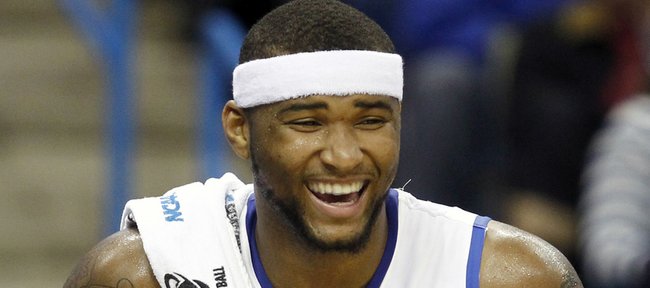 Kentucky guard DeMarcus Cousins celebrates on the bench during an NCAA college basketball game against East Tennessee State in New Orleans, Thursday, March 18, 2010. Kentucky won 100-71.
