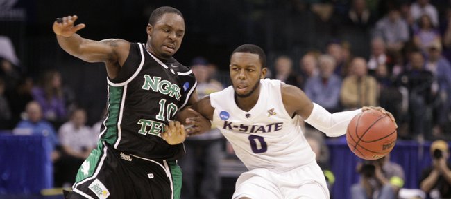 Kansas State guard Jacob Pullen drives up the court against North Texas guard Josh White during the second half Thursday, March 18, 2010 at the Ford Center in Oklahoma City.