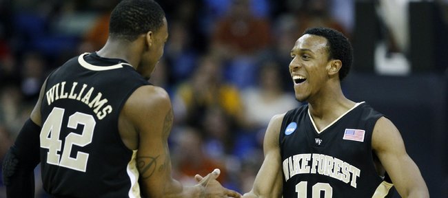 Wake Forest guard Ishmael Smith (10) is congratulated by guard L.D. Williams (42) after making a shot during an NCAA college basketball game against Texas in New Orleans, Thursday, March 18, 2010.
