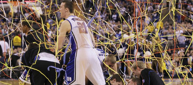 Duke's Miles Plumlee (21) and teammates celebrate after Duke's 61-59 win over Butler in the men's NCAA Final Four college basketball championship game Monday, April 5, 2010, in Indianapolis. 