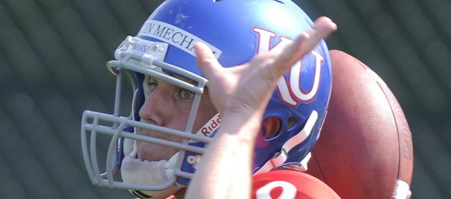 Kansas quarterback Quinn Mecham looks to throw during practice in this April 12 file photo. Now that Kale Pick is injured, Mecham will be KU’s backup quarterback.