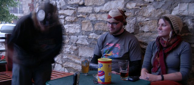 Beatboxing Lobo (left), Adam Reetz and Emily Seitter on the Free State Brewery patio.