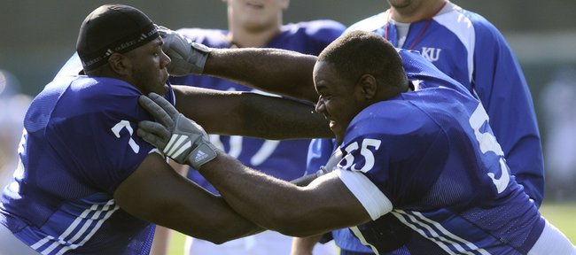 Kansas offensive linemen Jeff Spikes, left, and Darius Parish work on technique during practice Tuesday, Aug. 11, 2009 at the practice fields adjacent to Memorial Stadium.