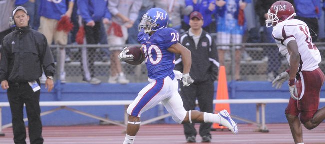 Kansas University kick returner D.J. Beshears (20) is cheered on by the student section as he breaks free for a 96-yard touchdown return in this 2010 file photo. Beshears is listed as a preseason third-team All-Big 12 selection by analyst Phil Steele.