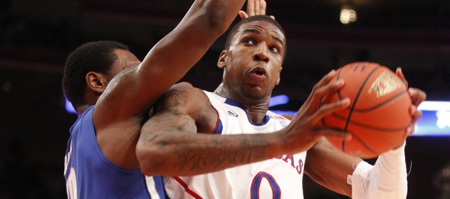 Kansas forward Thomas Robinson gets physical with Memphis forward Tarik Black during the second half of the Jimmy V Classic Tuesday, Dec. 7, 2010 at Madison Square Garden in New York. Robinson had a double-double: 10 points, 10 boards.