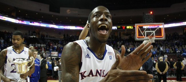 Kansas guard Tyshawn Taylor claps with excitement following the Jayhawks' 87-79 victory against Arizona, Saturday, Nov. 27, at the Orleans Arena.