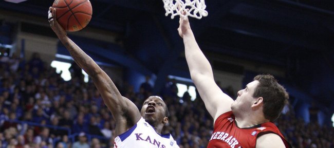 Kansas guard Tyshawn Taylor heads to the bucket against Nebraska forward Andre Almeida during the second half on Saturday, Jan. 15, 2011 at Allen Fieldhouse.