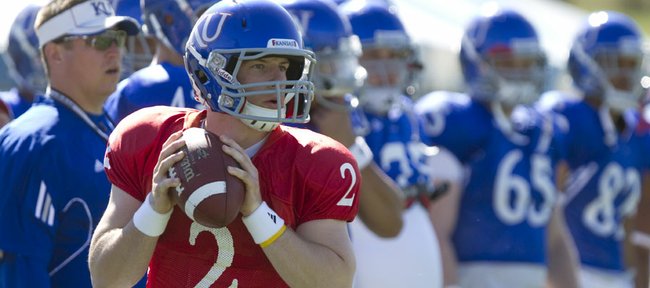 Kansas quarterback Jordan Webb looks over his receivers as he runs through plays with the offense during practice on Monday, April 11, 2011 at the KU practice fields.