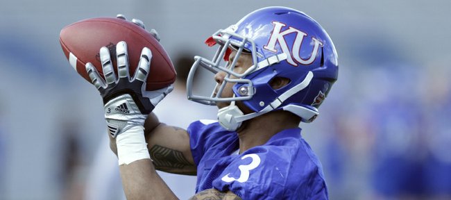 Kansas running back Darrian Miller pulls in a pass during spring workouts at the practice facility on Friday, April 1, 2011.
