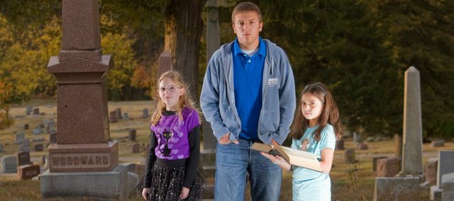 From left, Mikayla Kaufman, 10; Nathan Herrman, 17; and Amelia Carttar, 11, turned in stories about haunted corn mazes, white rooms with no escape and haunted graves. While each of these stories were uniquely their own, we all agreed they had certain spine-tingling quality that made them stand out from the rest.