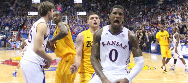 Kansas forward Thomas Robinson celebrates for the television cameras after a put-back dunk against Long Beach State during the second half Tuesday, Dec. 6, 2011 at Allen Fieldhouse.