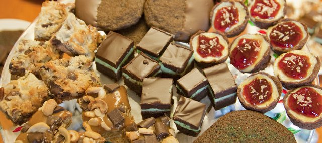 Cookies shown include Mademoiselle Cherry's Incredibly Good Looking and Incendiary GingerDoodles, Chocolate Mint Brownies, Vegan Molasses Cookies, Mini Cheesecake Tarts, Caramel Cashew Chewies and 7-Layer Cookies.