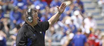 Kansas head coach Charlie Weis calls a play during the first half of the Spring Game on Saturday, April 28, 2012 at Kivisto Field.