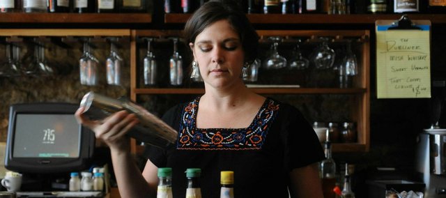 Bartender Katie Wade says part of her job at 715 restaurant is inventing new drinks.