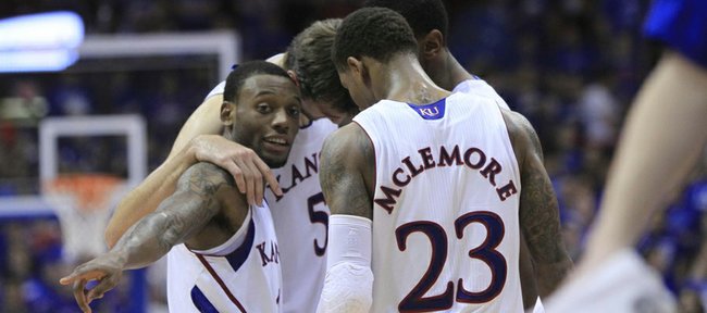 KU sophomore Naadir Tharpe, left front, gets his team together in the final minutes against Southeast Missouri State on Friday at Allen Fieldhouse. KU defeated SEMO, 74-55.