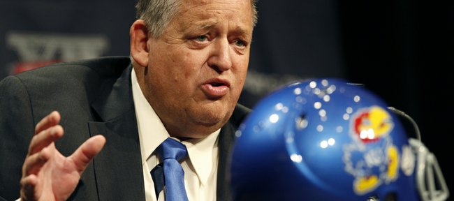Kansas football coach Charlie Weis answers questions from the media during the Big 12 Conference Football Media Days Monday, July 22, 2013 in Dallas.
