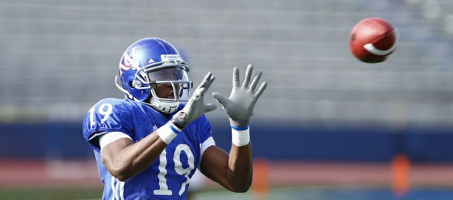 Kansas receiver Justin McCay makes a catch during a spring practice on Tuesday, April 2, 2013 at Memorial Stadium.