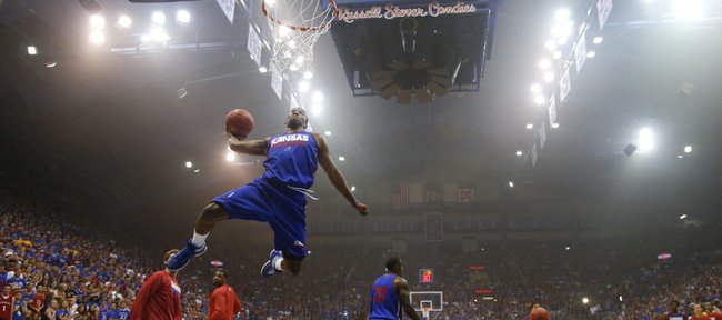 Kansas freshman guard Wayne Selden soars in for a dunk during an unofficial dunk contest during warmups before a scrimmage.