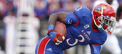Kansas running back Tony Pierson shakes Texas Tech defensive back Bruce Jones during the first quarter on Saturday, Oct. 5, 2013 at Memorial Stadium.