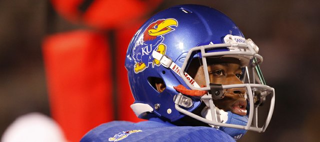 Kansas backup quarterback Montell Cozart watches the scoreboard against Baylor during the second quarter on Saturday, Oct. 26, 2013.
