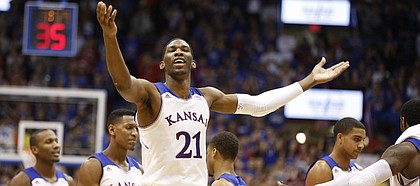 Kansas center Joel Embiid raises up the fieldhouse during a Jayhawk run in the second half on Friday, Nov. 22, 2013 at Allen Fieldhouse.