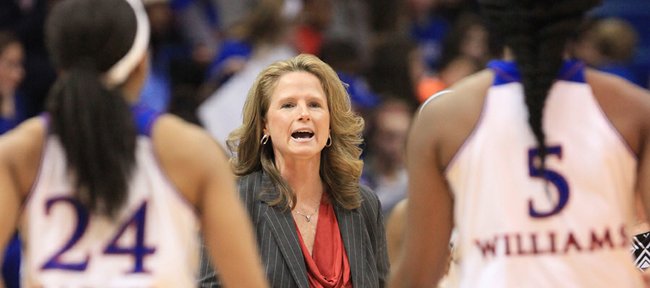 Kansas University coach Bonnie Henrickson instructs her players during the first half on Thursday, Jan. 2, 2014, at Allen Fieldhouse. West Virginia won, 65-55, in the Big 12 Conference opener for both teams.