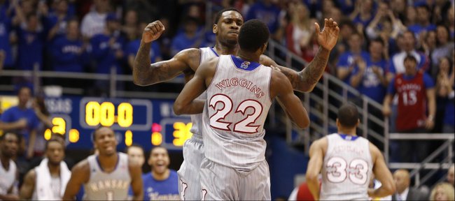 Kansas forward Tarik Black chest bumps teammate Andrew Wiggins after Wiggins finished the first half with a put-back dunk against West Virginia on Saturday, Feb. 8, 2014 at Allen Fieldhouse.