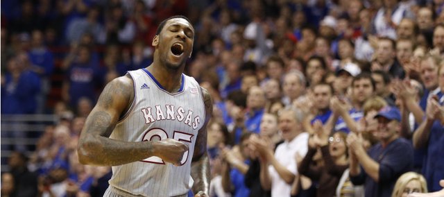 Kansas forward Tarik Black pounds his chest as he checks out of the game for the final time during the second half on Wednesday, March 5, 2014 at Allen Fieldhouse.