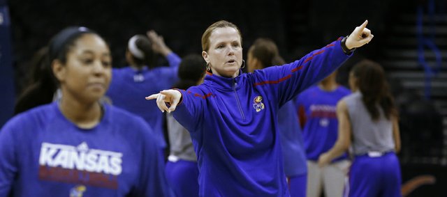 Kansas women's basketball coach Bonnie Henrickson gestures to her team during a practice for the Big 12  tournament on Thursday in Oklahoma City.