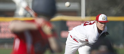 Lawrence High starter Bryce Montes de Oca delivers to the plate against an Olathe North batter during the second inning, Thursday, April 10, 2014 at Free State High School.