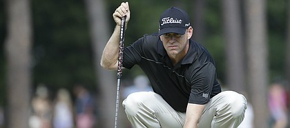Chris Thompson lines up a putts on the 12th hole during the second round of the U.S. Open golf tournament in Pinehurst, N.C., Friday, June 13, 2014. (AP Photo/David Goldman)