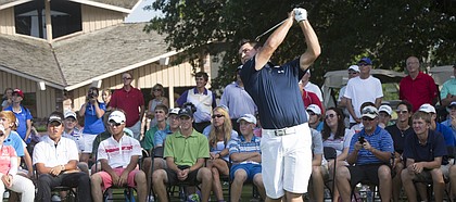 Former Kansas University golfer Gary Woodland demonstrates a tip during a clinic for junior golfers on Monday, June 16, 2014, at Alvamar.