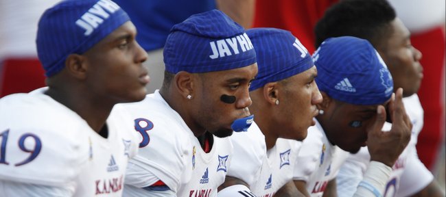 A somber bench of Kansas receivers including Nick Harwell (8) lament the 41-3 loss to Duke with minutes remaining during the fourth quarter on Saturday, Sept. 13, 2013 at Wallace Wade Stadium in Durham, North Carolina.