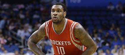 Houston Rockets' Tarik Black (10) looks to pass the ball against the Orlando Magic during the first half of an NBA preseason basketball game in Orlando, Fla., Wednesday, Oct. 22, 2014.