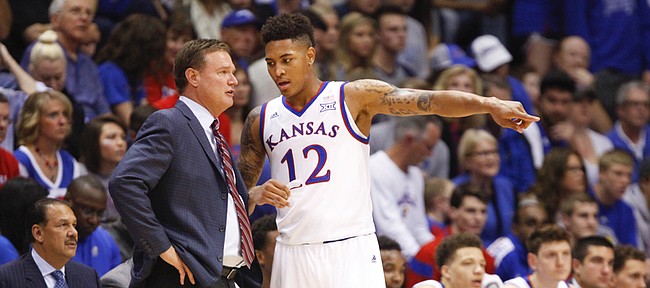 Kansas head coach Bill Self and guard Kelly Oubre have a chat on the sideline during the first half on Monday, Nov. 3, 2014 at Allen Fieldhouse.