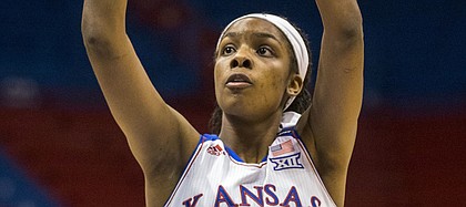 Kansas senior forward Chelsea Gardner scores one of her game high 24 points during the second half of Kansas' game against South Dakota Sunday afternoon at Allen Fieldhouse. The Jayhawks held off the Coyotes, 68-60, for a season opening victory. Despite being in foul trouble for much of the game, Gardner's 24 points put her in the 1,000 career points club at KU.