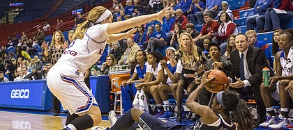 Kansas freshman guard Lauren Aldridge, left, applies pressure defense while Georgetown freshman guard Dorothy Adomako (34) looks for a teammate during the final game of the 2014 Naismith Hall of Fame Women's Challenge Sunday afternoon at Allen Fieldhouse. Despite a poor shooting performance, the Jayhawks outlasted the Hoyas, 55-42, improving their record to 4-1 on the season. Kansas is set to face off against Iona on Wednesday at Allen Fieldhouse with a tip off time scheduled for 8 p.m.